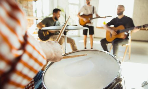 musician-band-jamming-together-in-art-workplace-with-instruments